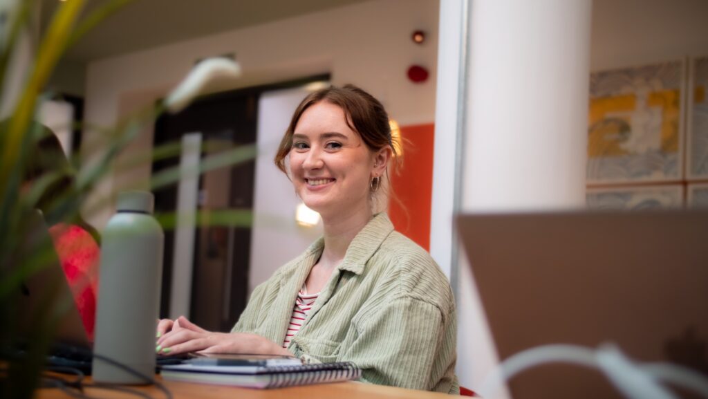 Portrait of DHD Junior Designer, Orlagh McCloskey working in Ormeau Baths office, Belfast.